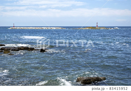 Waves crashing the rocks at Porec beach, Istria, Croatia. Waves crashing the rocks at Porec beach, Istria, Croatia. 83415952
