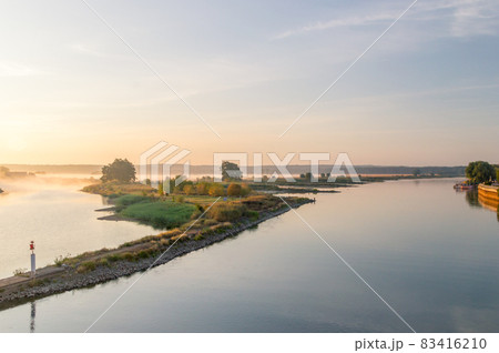 Sunrise over border river Oder. Oder is river between Poland and German. Sunrise view from Frankfurt Oder. 83416210