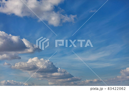 A blue sky background with a texture of white fluffy clouds A blue sky background with a texture of white fluffy clouds 83422062