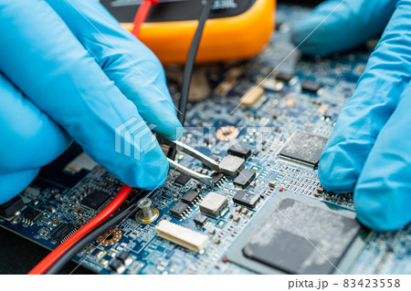 technician repairing inside of hard disk by soldering iron. Integrated Circuit. the concept of data, hardware, technician and technology. technician repairing inside of hard disk by soldering iron. Integrated Circuit. the concept of data, hardware, technician and technology. 83423558