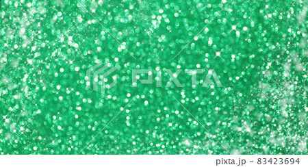 Defocused Christmas green background. Holiday abstract glitter defocused background with blinking bokeh.Holiday glowing backdrop.Banner. 83423694