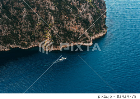 Summer landscape with sea and mountain range. Sea aerial view. Blue mountains and blue sea. Landscapes of Turkey city of Marmaris. Aerial view of a paradise sea with clear water. Copy space 83424778