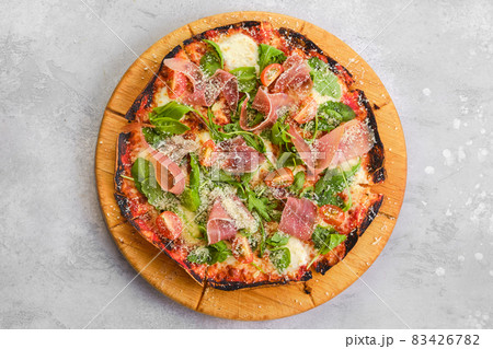Thin-crust pizza dough with prosciutto 83426782