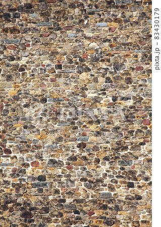 Old large weathered distressed Norman medieval stone brick wall background Old large weathered distressed Norman medieval stone brick wall background 83430179
