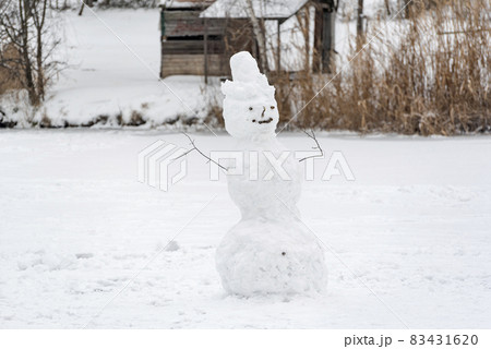 Snowman on winter park background. Winter holidays. Snowy landscape. Winter time. 83431620