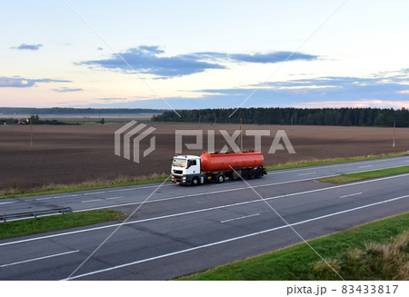 Isothermal Tank truck driving on highway. Isothermal Tank truck driving on highway. 83433817