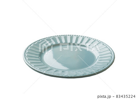 Blue ceramic round plate isolated over white background. perspective view 83435224