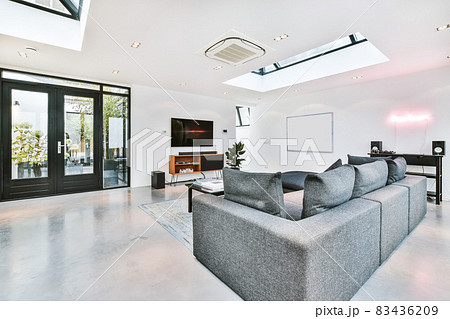 Elegant living room with a large TV and sofa 83436209