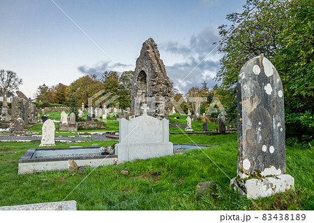 The sun is setting above the Abbey Graveyard which was build by Hugh O Donnell in 1474 - all names and artwork removed 83438189