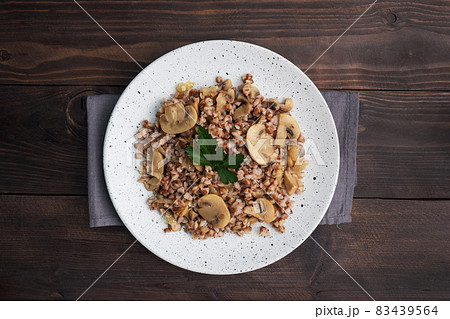 Boiled buckwheat with stewed mushrooms. Russian traditional food. Healthy diet food. copy space, top view. 83439564