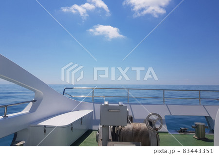 View of the calm sea from the deck of a luxury yacht, the concept of relaxing on the water and a romantic trip View of the calm sea from the deck of a luxury yacht, the concept of relaxing on the water and a romantic trip 83443351