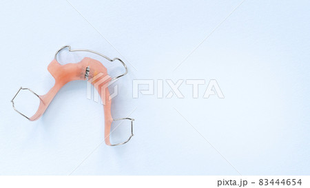removable orthodontic appliance on Blue. Concept of healthy teeth. removable orthodontic appliance on Blue. Concept of healthy teeth. 83444654