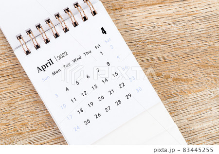April calendar 2022 on wooden background. 83445255