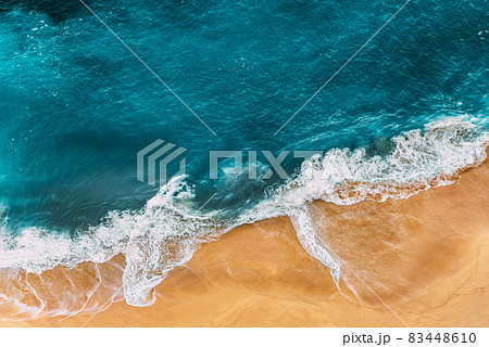 Relaxing aerial beach scene, summer vacation holiday template banner. Waves surf with amazing blue ocean lagoon, sea shore, coastline. Perfect aerial drone top view. Peaceful bright beach, seaside 83448610