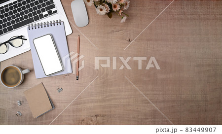 Top view mock up smart phone, notebook and laptop computer on wooden table. 83449907