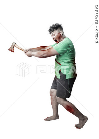 Scary zombie with blood and wound on his body holding ax standing Scary zombie with blood and wound on his body holding ax standing 83453391
