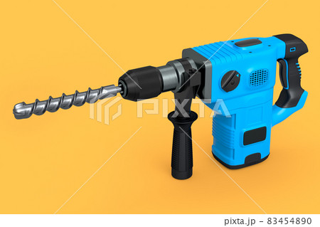 Electric drill with cord and attached metal bit, tool for repair on yellow 83454890