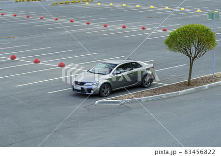 Sports coupe car is parked alone in a city car parking 83456822