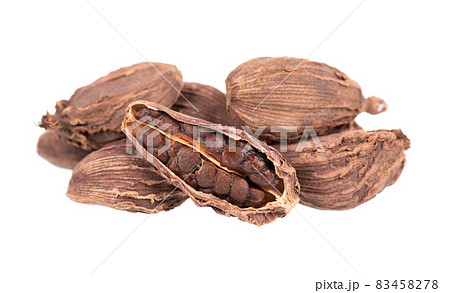 Heap of black cardamom pods isolated on white background. Black cardamon seeds. Clipping path. Heap of black cardamom pods isolated on white background. Black cardamon seeds. Clipping path. 83458278