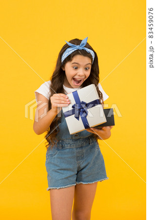 surprised kid on yellow background. birthday surprise surprised kid on yellow background. birthday surprise 83459076