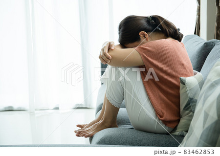 Woman sitting on sofa. Woman sitting on sofa. 83462853
