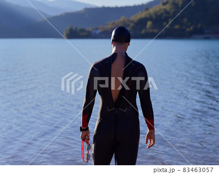 triathlete swimmer portrait wearing wetsuit on training triathlete swimmer portrait wearing wetsuit on training 83463057