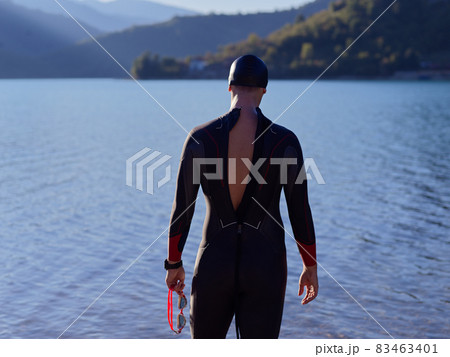 triathlete swimmer portrait wearing wetsuit on training 83463401