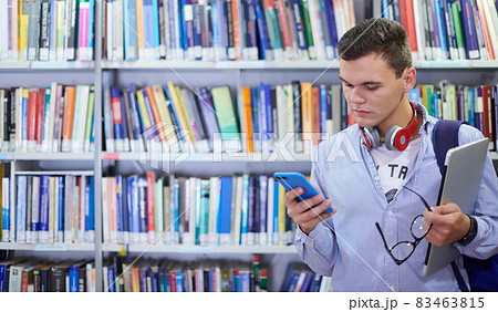 the student uses a notebook, latop and a school library the student uses a notebook, latop and a school library 83463815