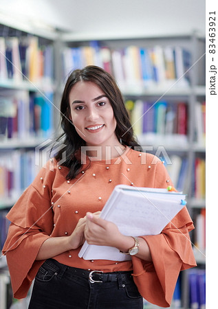the student uses a notebook and a school library the student uses a notebook and a school library 83463921