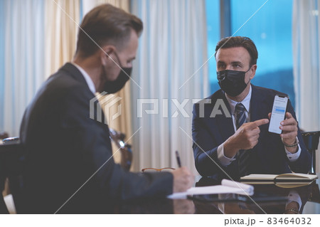 business people wearing crona virus protection face mask on meeting 83464032