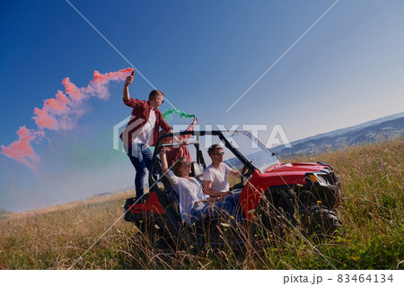 colorful torches while driving a off road buggy car 83464134