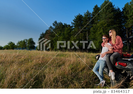 couple enjoying beautiful sunny day while driving a off road buggy couple enjoying beautiful sunny day while driving a off road buggy 83464317