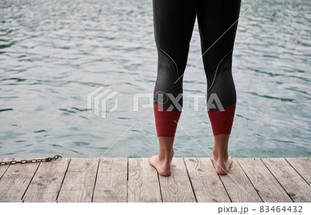 triathlete swimmer portrait wearing wetsuit on training triathlete swimmer portrait wearing wetsuit on training 83464432