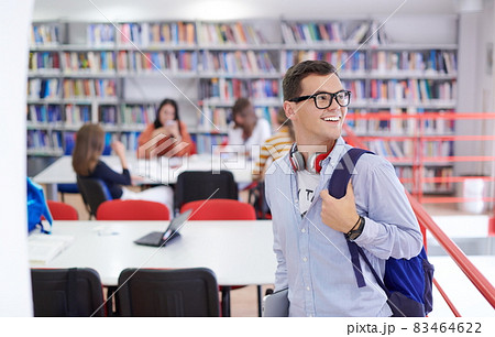 the student uses a notebook, latop and a school library 83464622