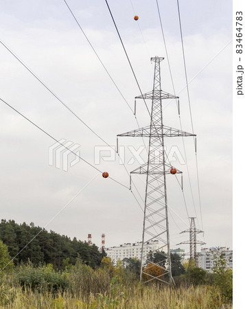 High towers of power transmission lines. Metal structures for providing electricity in suburbs. High towers of power transmission lines. Metal structures for providing electricity in suburbs. 83464783