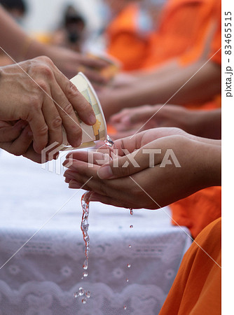 This is rite sprinkle water onto a monk , Buddha image on Songkran festival Thailand 83465515