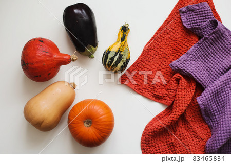 different types of pumpkins and eggplant on white background 83465834