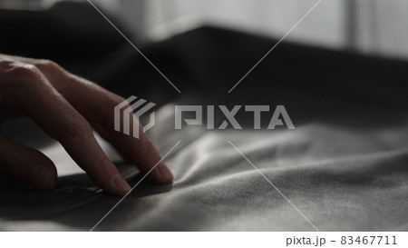 Closeup man touching fine leather 83467711