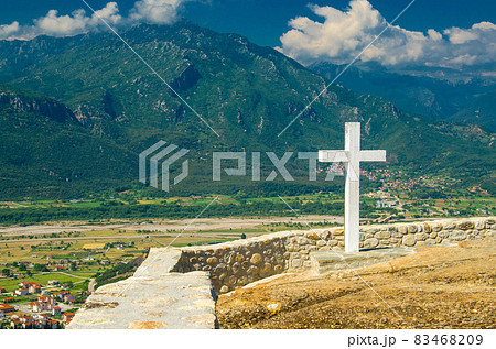 Big white cross of Holy Trinity Meteora Monastery, Kalabaka, Greece Big white cross of Holy Trinity Meteora Monastery, Kalabaka, Greece 83468209