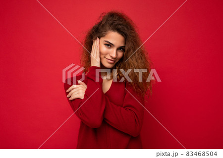 Photo of beautiful positive smiling adult woman wearing stylish clothes standing isolated on Photo of beautiful positive smiling adult woman wearing stylish clothes standing isolated on 83468504