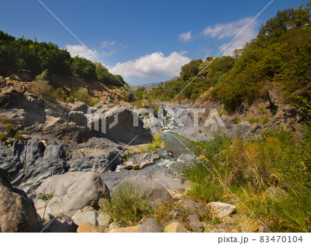 Gole Alcantara Sicilian national park. Alcantara river gorge canyon with volcanic lava caves and rocks. A touristic attraction in Sicily Italy 83470104