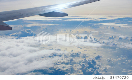 Storm clouds and part of the wing of the aircraft window. 83470720