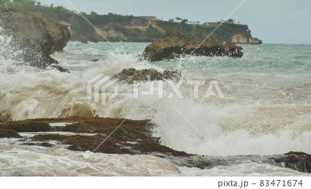 Slow mtion stony and rocky shore with strong waves and wind near Bali island. Tegal Wangi beach. Indonesia. Slow mtion stony and rocky shore with strong waves and wind near Bali island. Tegal Wangi beach. Indonesia. 83471674