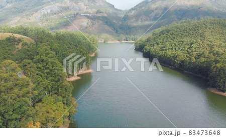 Aerial view beautiful nature with mountains and hills by Lake Mattupetty. Kerala State. Near the city of Munar. Aerial view beautiful nature with mountains and hills by Lake Mattupetty. Kerala State. Near the city of Munar. 83473648