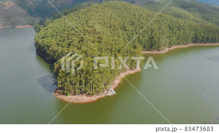 Aerial view beautiful nature with mountains and hills by Lake Mattupetty. Kerala State. Near the city of Munar. 83473683