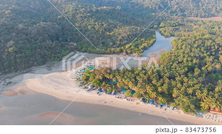 The beautiful nature of the state of Goa near the Palole beach at sunset and fishing boats. India. Drone view. The beautiful nature of the state of Goa near the Palole beach at sunset and fishing boats. India. Drone view. 83473756