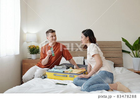 Man Showing QR to Girlfriend 83478288