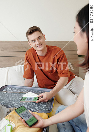 Couple Discussing Covid-19 Vaccine Passport Couple Discussing Covid-19 Vaccine Passport 83478296