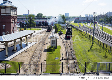 The locomotive departs from the railway station on a sunny summer morning 83480108