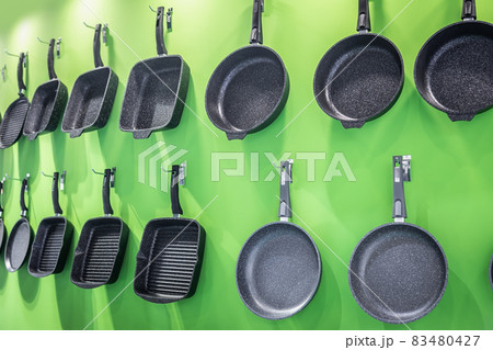 different types of non-stick frying pans for cooking 83480427